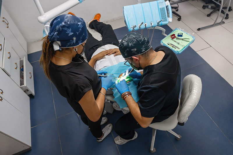 2025-06-NP1-the-dentist-brushes-teeth-of-patient.-regular-care-and-prevention-of-dental-diseases the dentist brushes teeth of patient. regular care and prevention of dental diseases. modern professional clinic